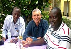 Michael Oxley with HSLA team Daudi Mugisa, training officer, and Patrick Ayebezibwe, extension officer