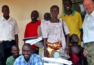 Martin Burgess handing over equipment.